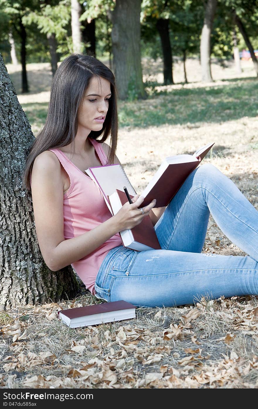 Young woman photographed in  park. Young woman photographed in  park