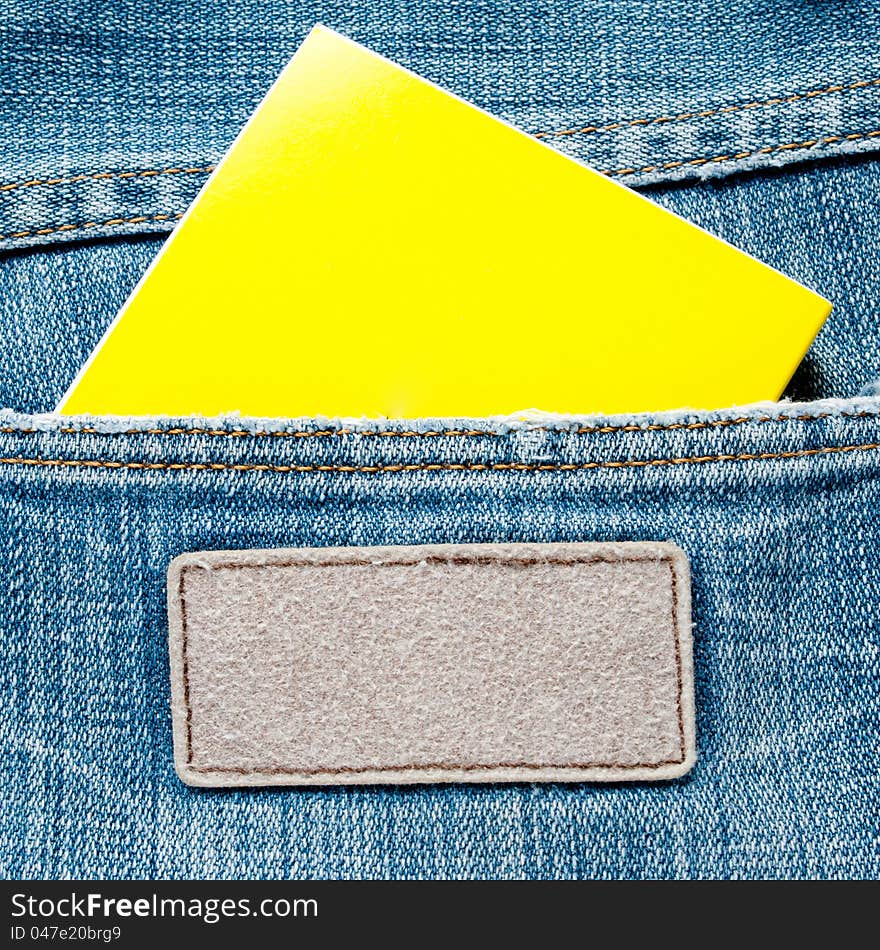 Blank yellow note on blue jeans texture old. Blank yellow note on blue jeans texture old