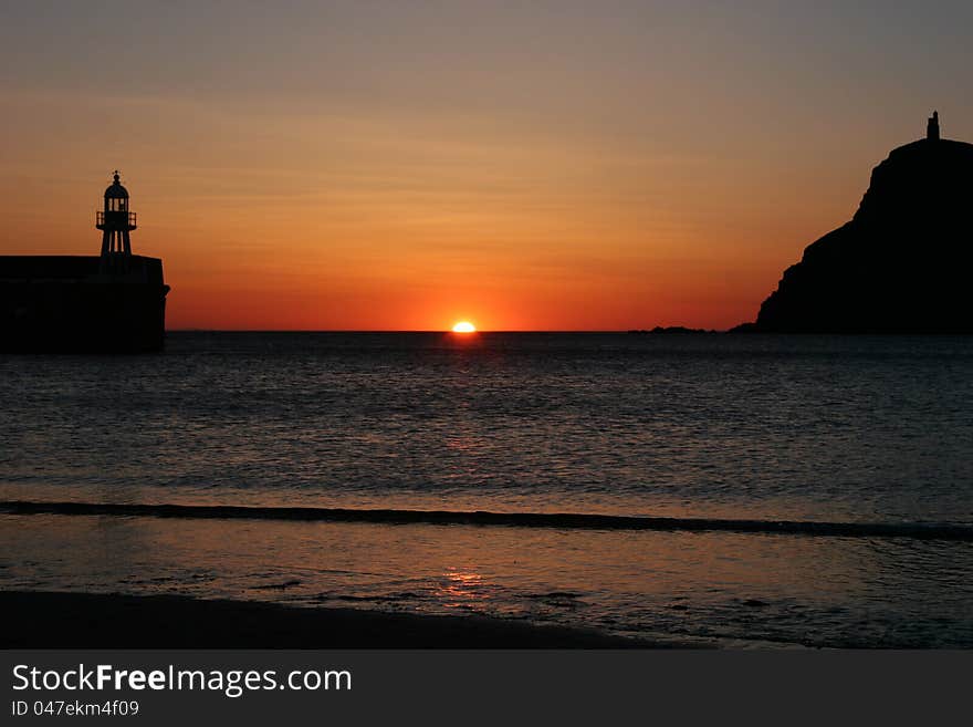 Sunset over the ocean at Port Enin on the Isle of Man