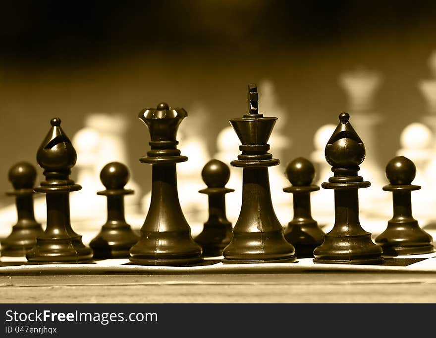 Black and white chess-man in sepia color