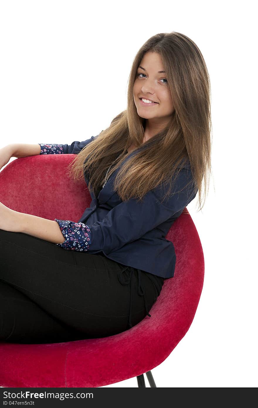 Young woman on the red couch, studio shot. Young woman on the red couch, studio shot