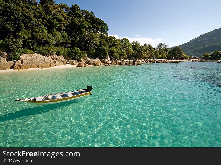 Boat floating at crystal clear waters