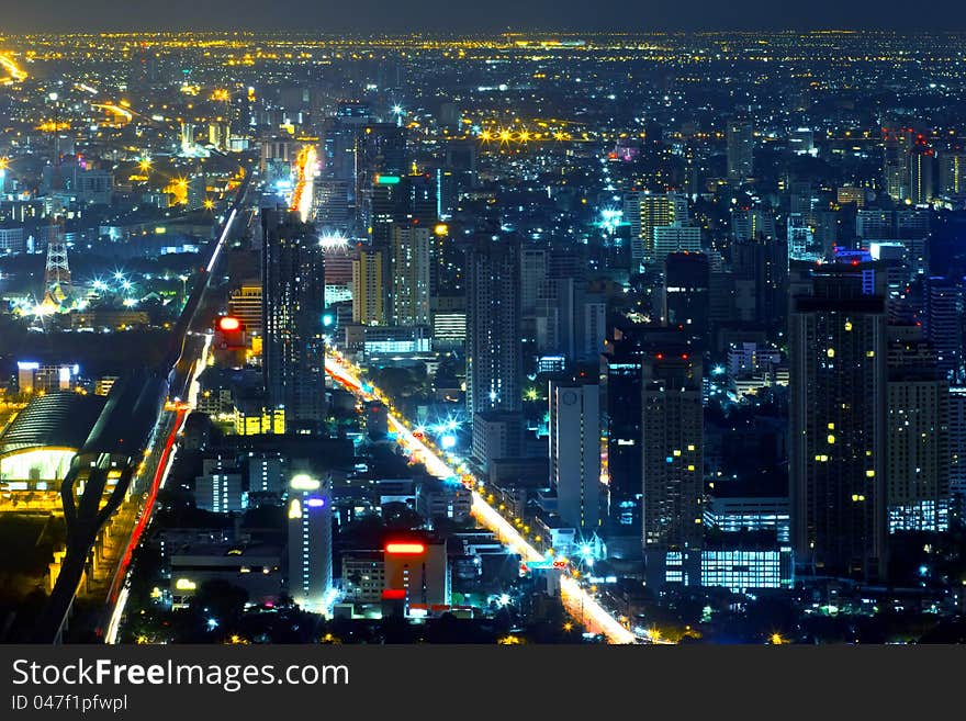 Modern skyscraper city streets in the night,Bangkok,Thailand. Modern skyscraper city streets in the night,Bangkok,Thailand