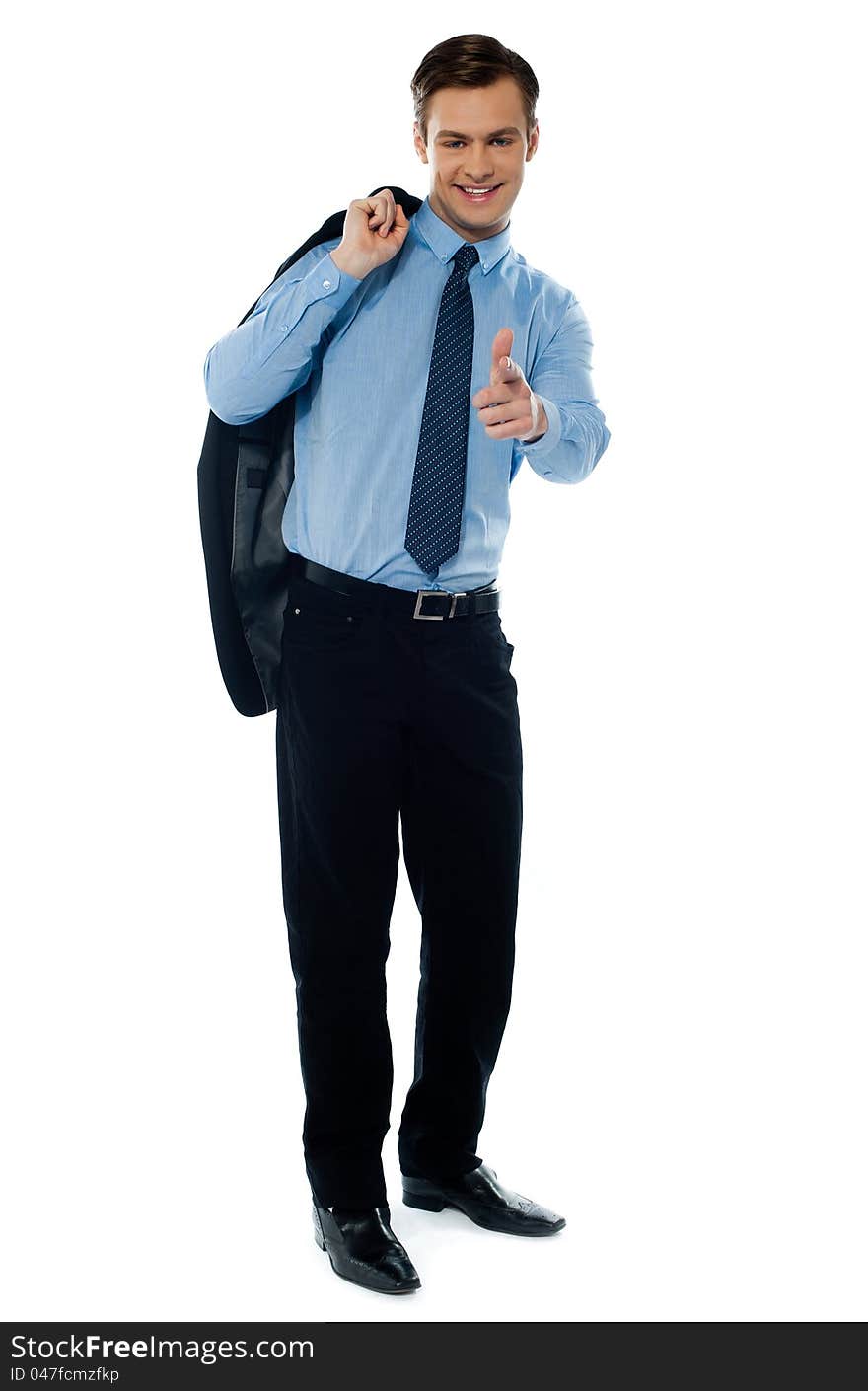 Young manager pointing towards camera on white background. Young manager pointing towards camera on white background