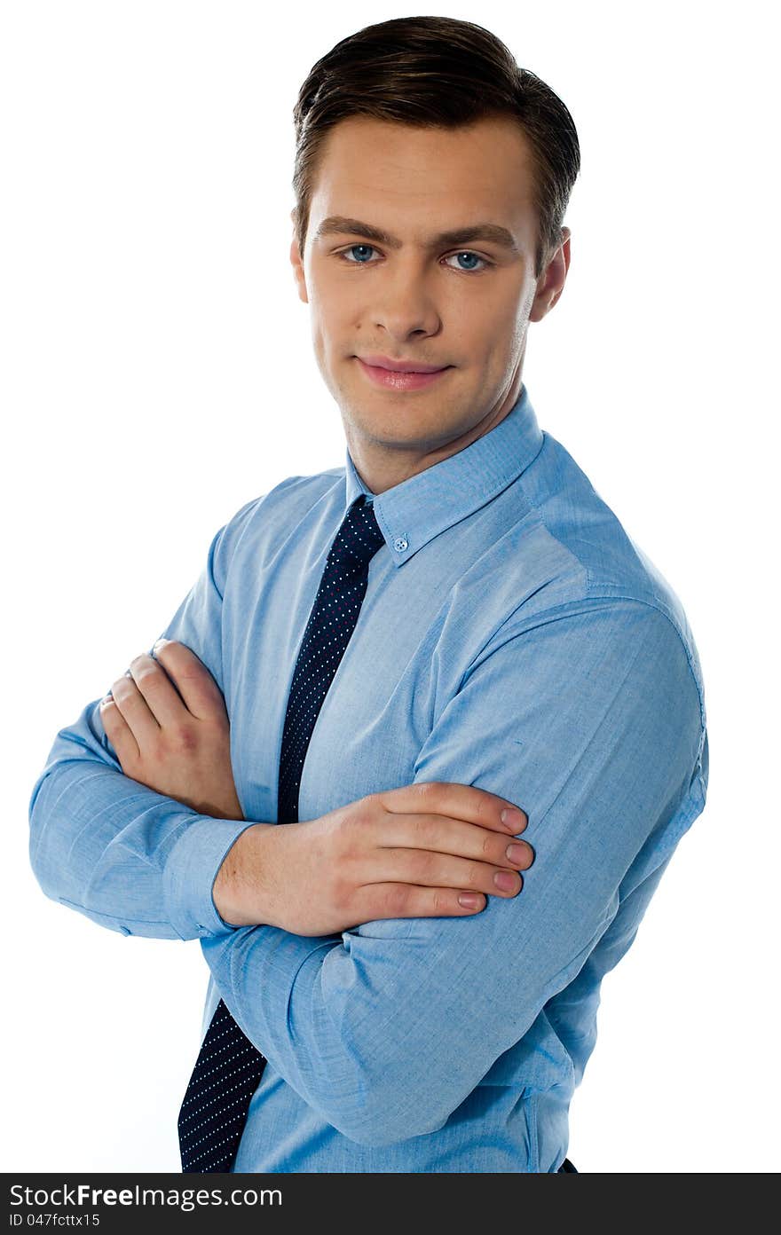 Businessman hposing with folded arms against white background. Businessman hposing with folded arms against white background