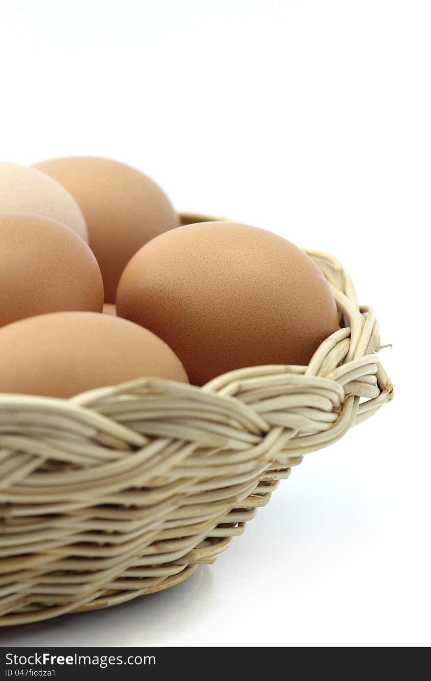 Eggs in one basket on white background