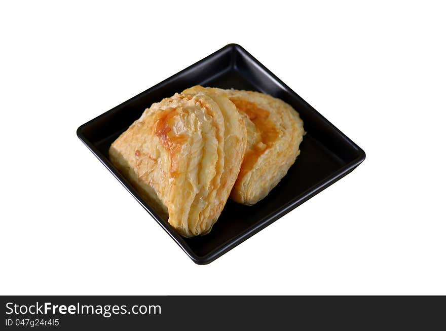 Puff pastry with tuna on the plate , white background. Puff pastry with tuna on the plate , white background