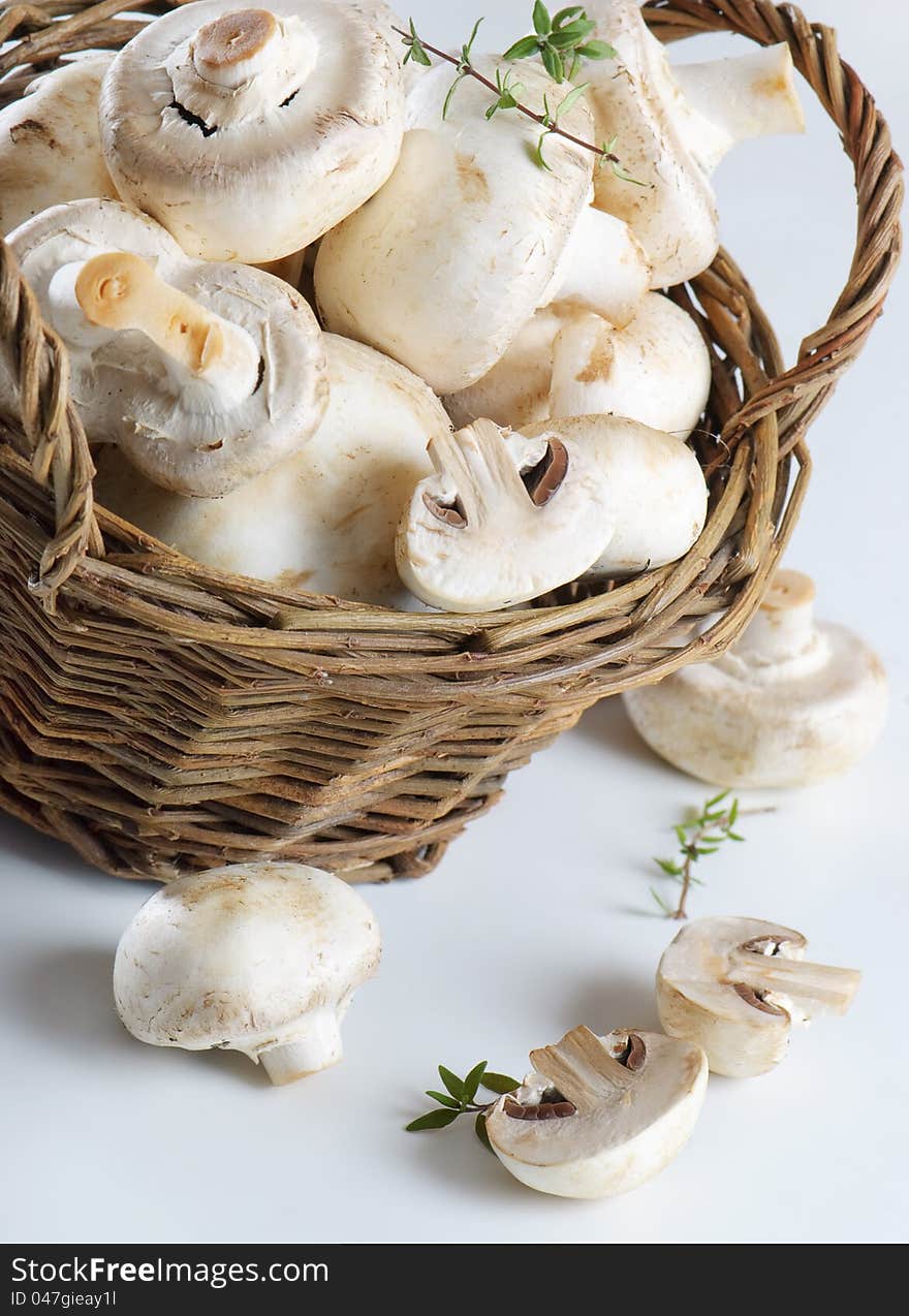 Champignons in basket  and herbs