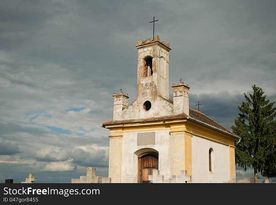 White small ruined chapel before the storm. White small ruined chapel before the storm