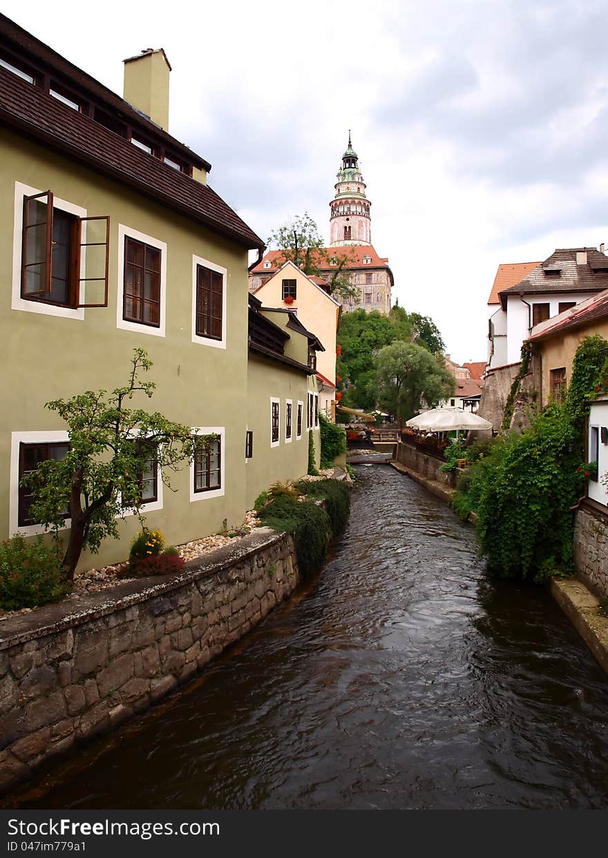 River canal in Cesky Krumlov. In background Český Krumlov Castle.