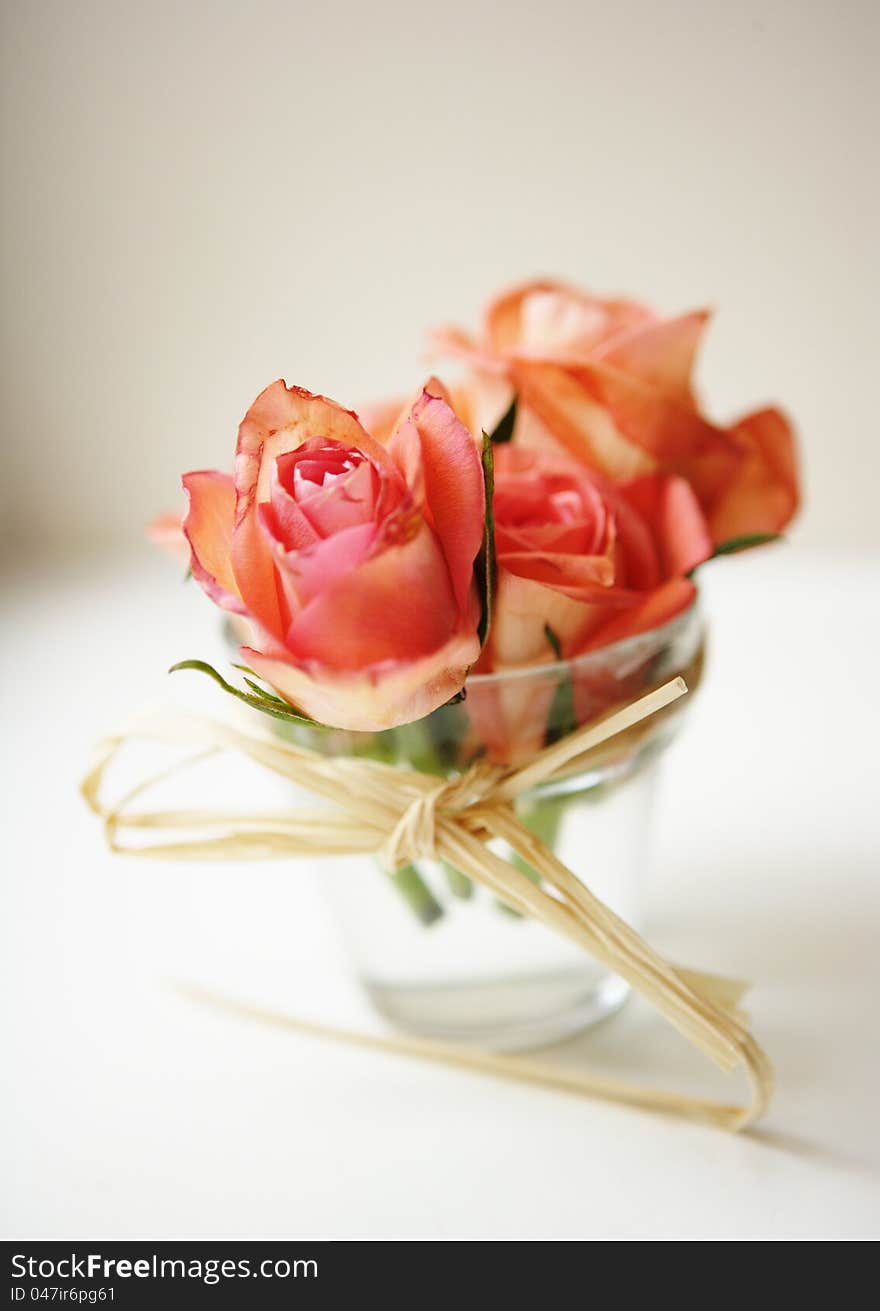 A wedding composition of roses in a glass