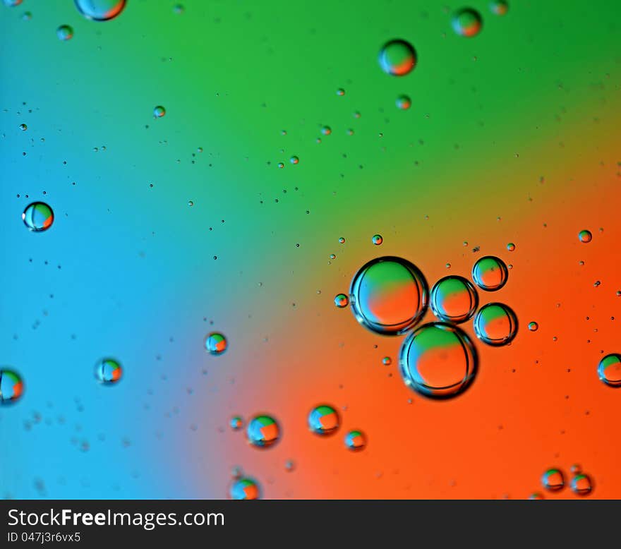 Color photo of bubbles at varying degrees of distance from viewer on multicolor background. Color photo of bubbles at varying degrees of distance from viewer on multicolor background