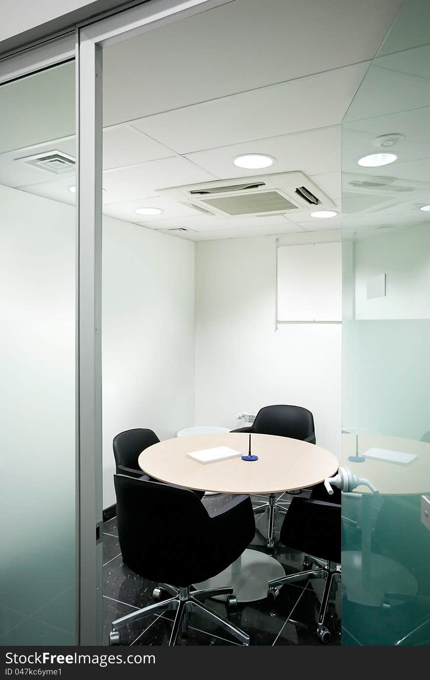 Empty Meeting Room with desk and chairs