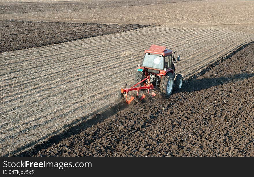 Tractor Plowing in sunset