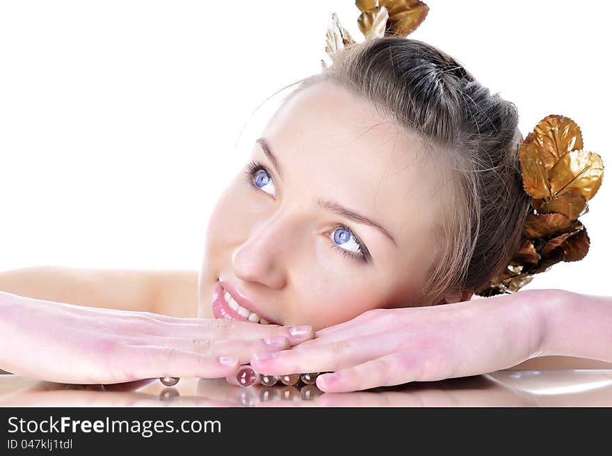 Portrait of a beautiful woman with a laurel wreath