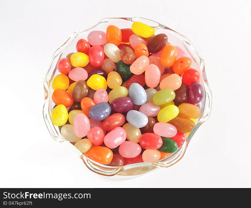 Jelly bean sweets (candies) in glass dessert bowl isolated on white. Jelly bean sweets (candies) in glass dessert bowl isolated on white.