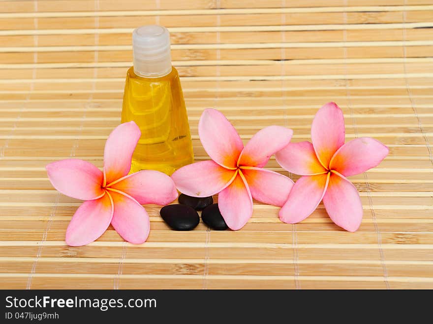 Tropical spa concept with plumeria flower and stones