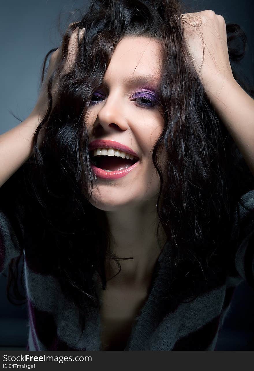 Portrait of a beautiful laughing brunette hair model. Hairstyle. Beauty. Lifestyle. Portrait of a beautiful laughing brunette hair model. Hairstyle. Beauty. Lifestyle