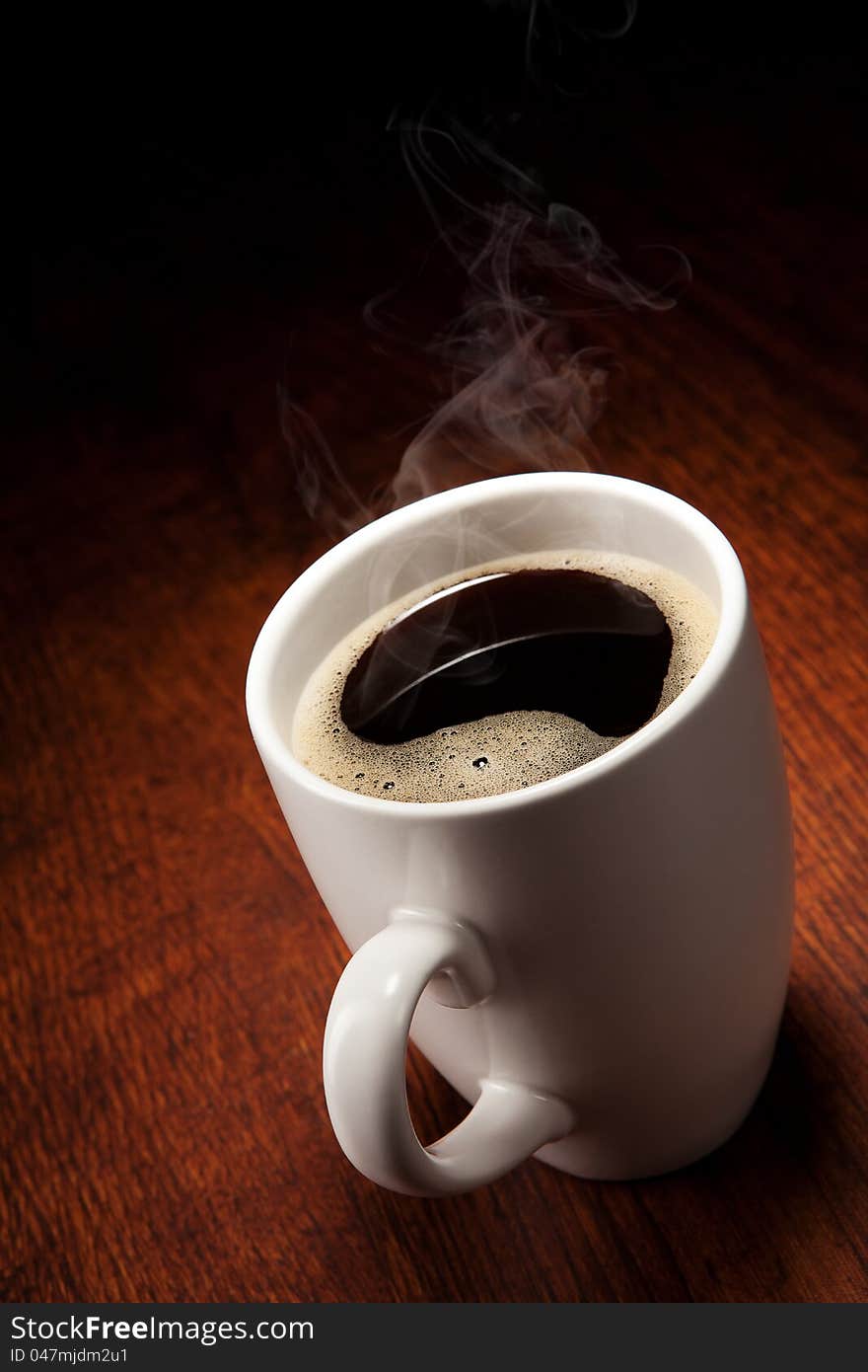 Hot Coffee cup on wooden table