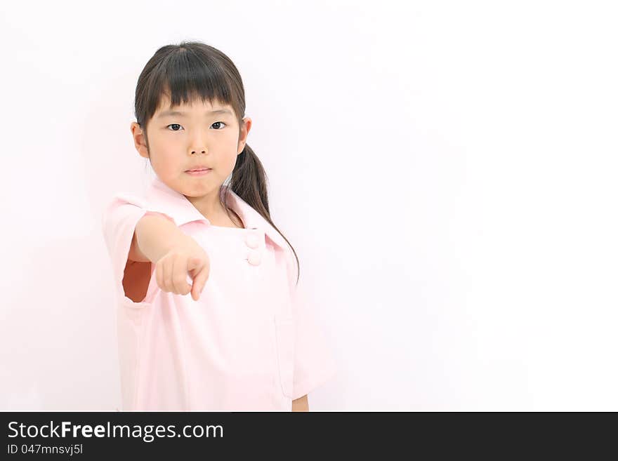 Portrait of asian happy little girl nurse pointing. Portrait of asian happy little girl nurse pointing