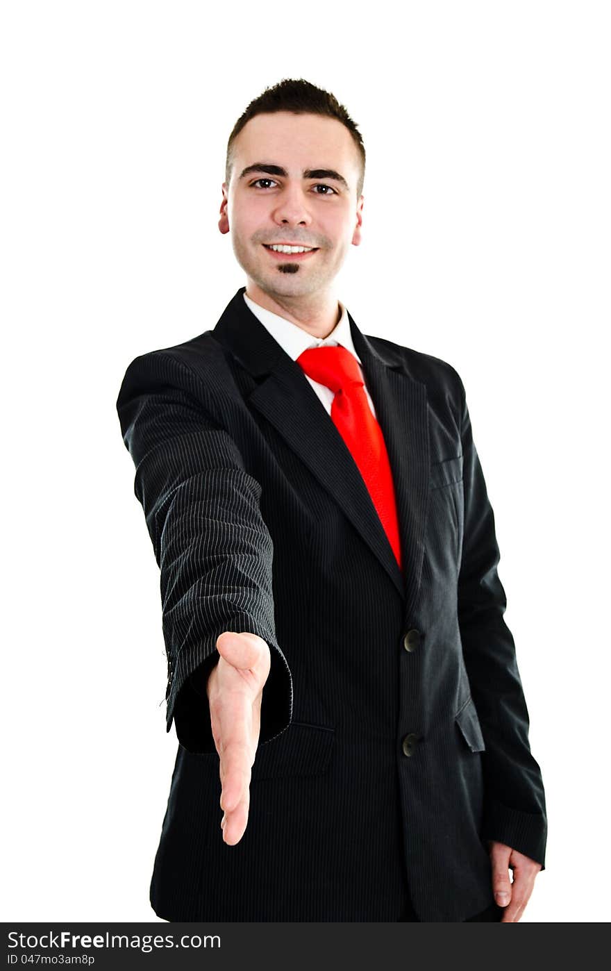 Young businessman stretching his hand for handshake. Young businessman stretching his hand for handshake