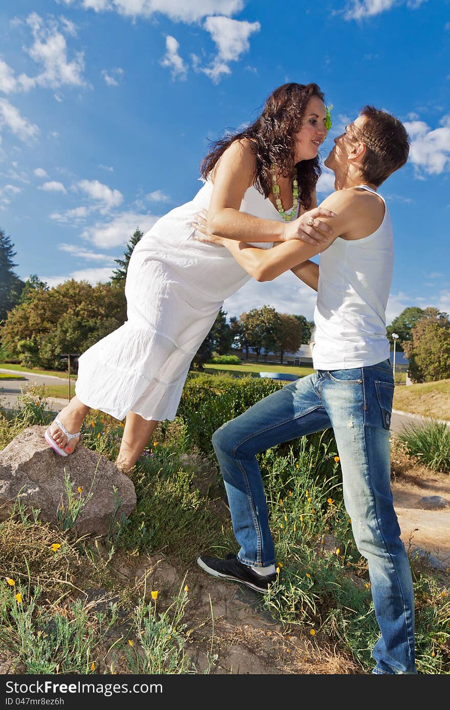 Pregnant couple resting in the park