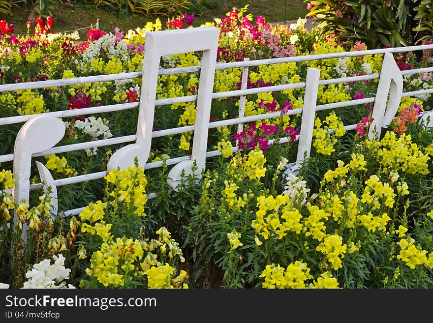Multicolored flowerbed decorate with musical note