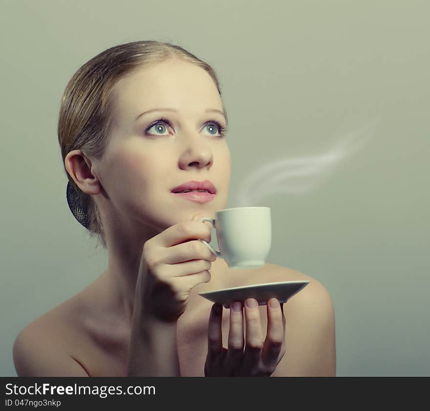 Beauty Young Woman Enjoying  Cup Of Coffee