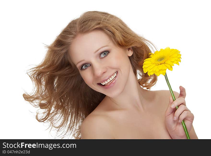 Beautiful young woman with yellow gerbera fl