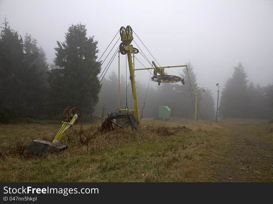 Old car in the Eagle Mountains, yellow cabin in the woods, autumn day in the fog in the mountains, the mountains of the Czech Republic, a place for winter holidays. Old car in the Eagle Mountains, yellow cabin in the woods, autumn day in the fog in the mountains, the mountains of the Czech Republic, a place for winter holidays