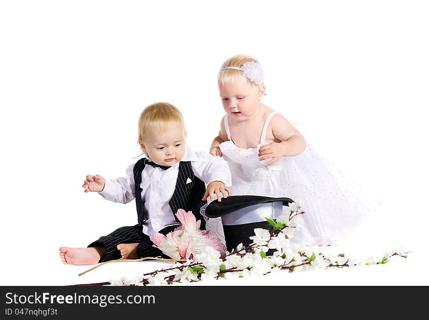 Girl and boy in a dress the bride and groom on a white background