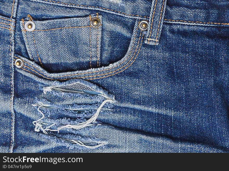 Old perforated jeans closeup