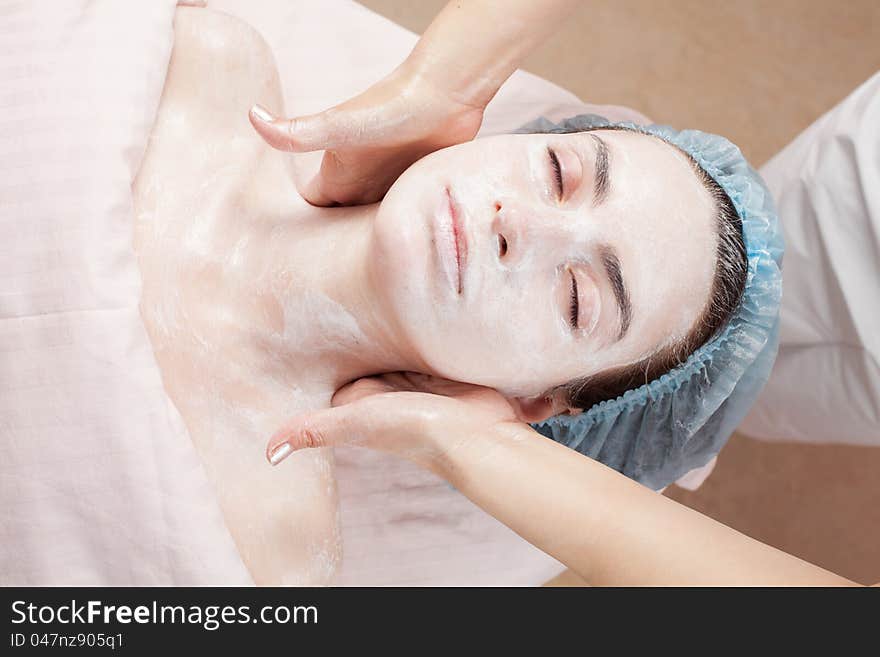 Beautiful woman with clear skin getting beauty treatment of her face at salon. Beautiful woman with clear skin getting beauty treatment of her face at salon.