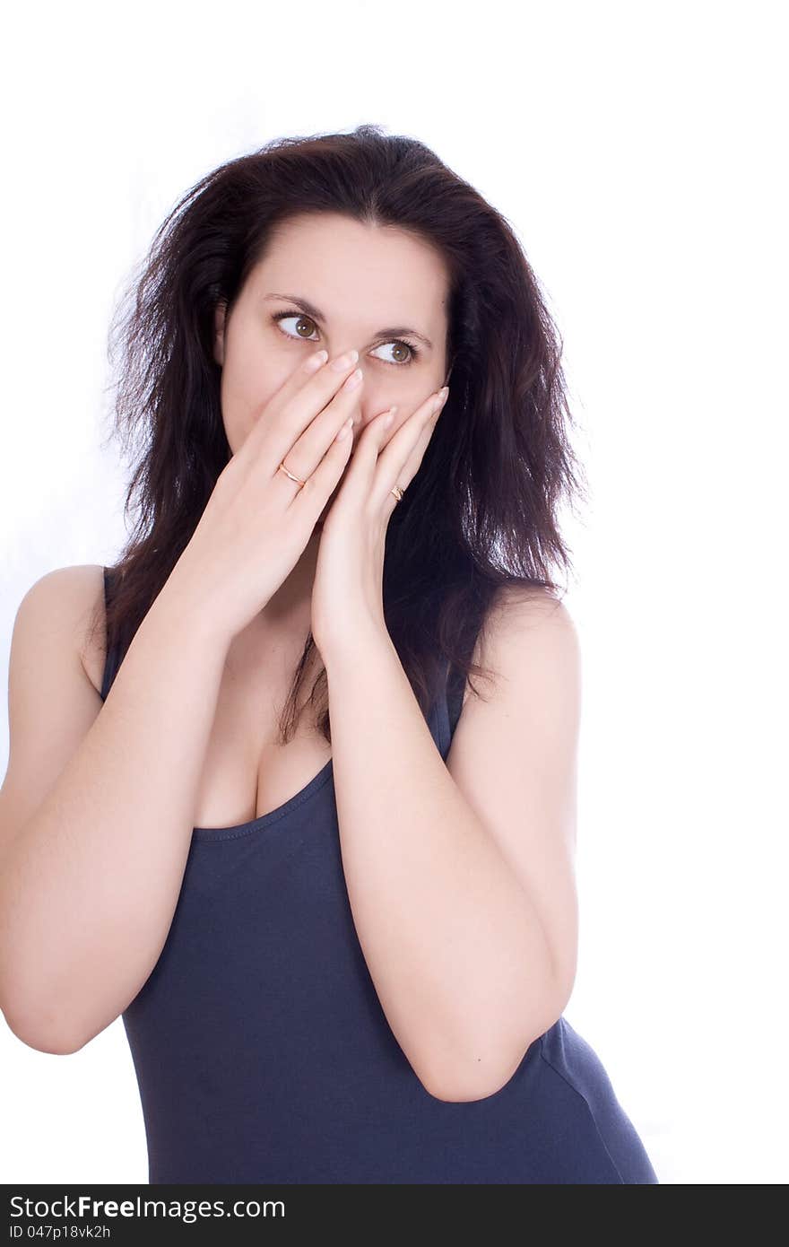 Scared woman hiding herself in her hands, isolated on white.