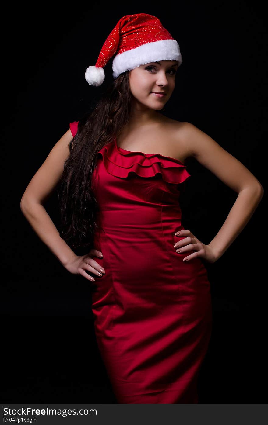 New year girl in red dress isolated on black