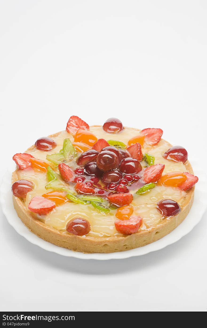 Fruit cake  on a plate over white background