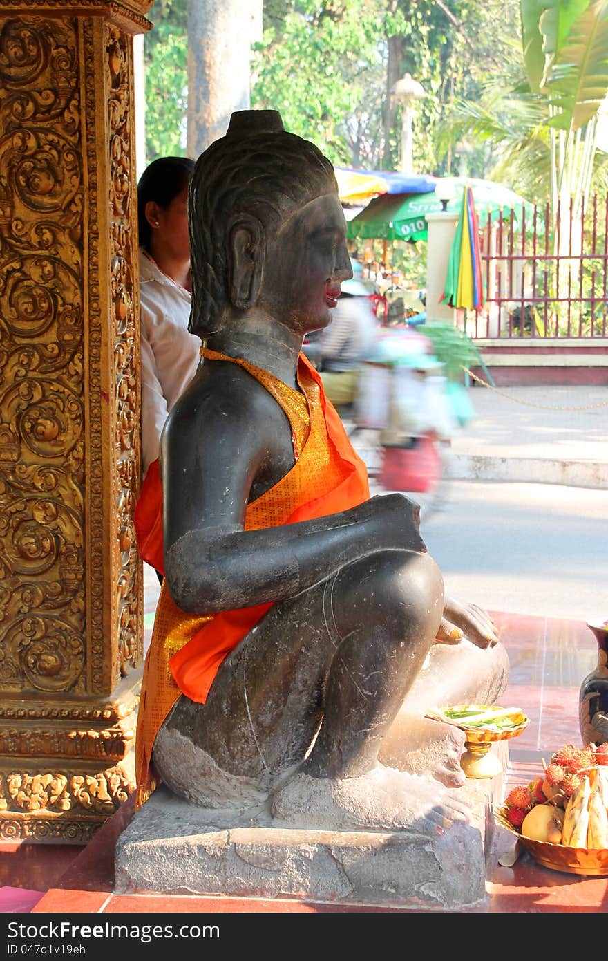 Buddha statue in buddhist sanctuary city pillar, Siemreap, Khmer Republic