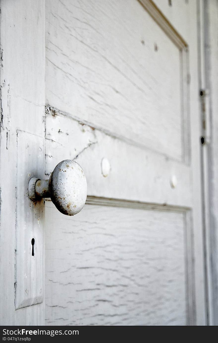 White door with a door knob close-up
