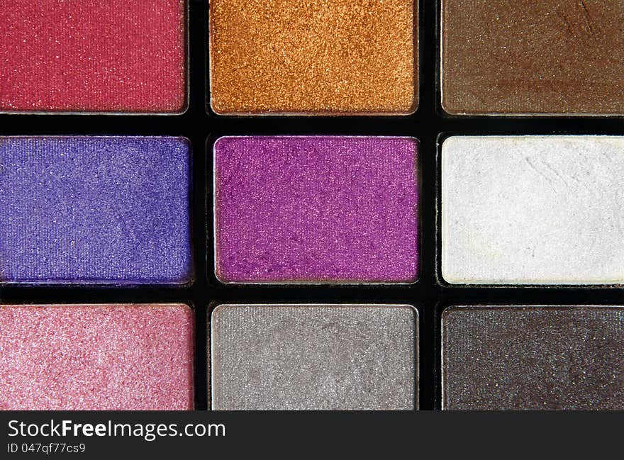 Closeup of colorful cosmetics eyeshadows. Closeup of colorful cosmetics eyeshadows