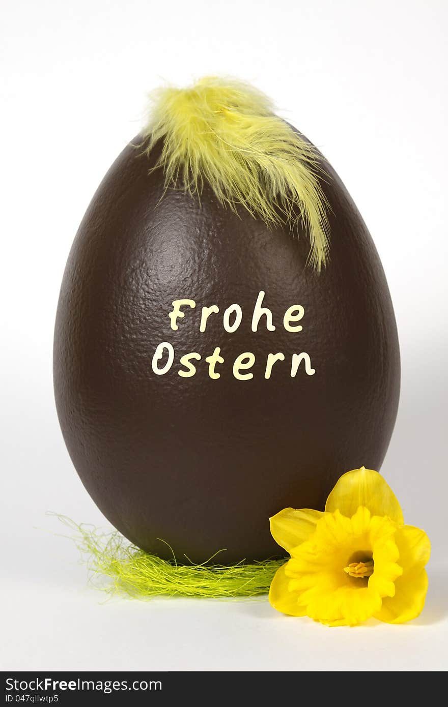 Chocolate easter egg with text: Frohe ostern. Chocolate easter egg with text: Frohe ostern