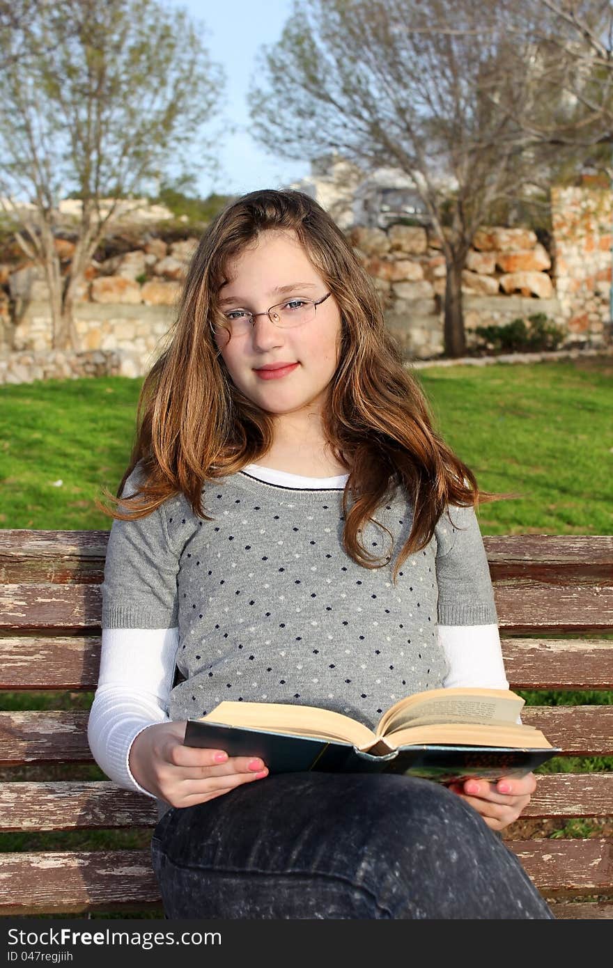 Young Girl  Reading A Book