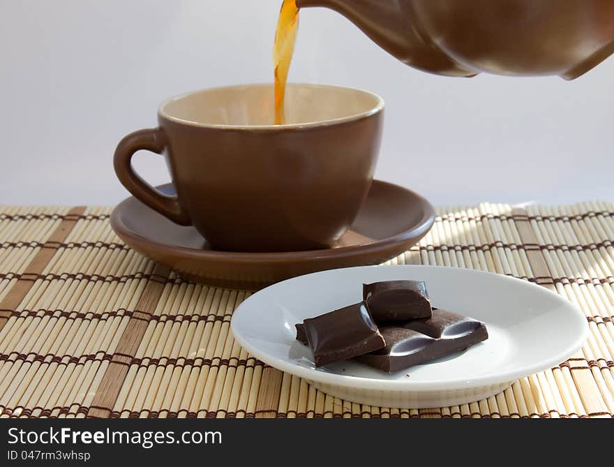 Pouring tea and chocolate