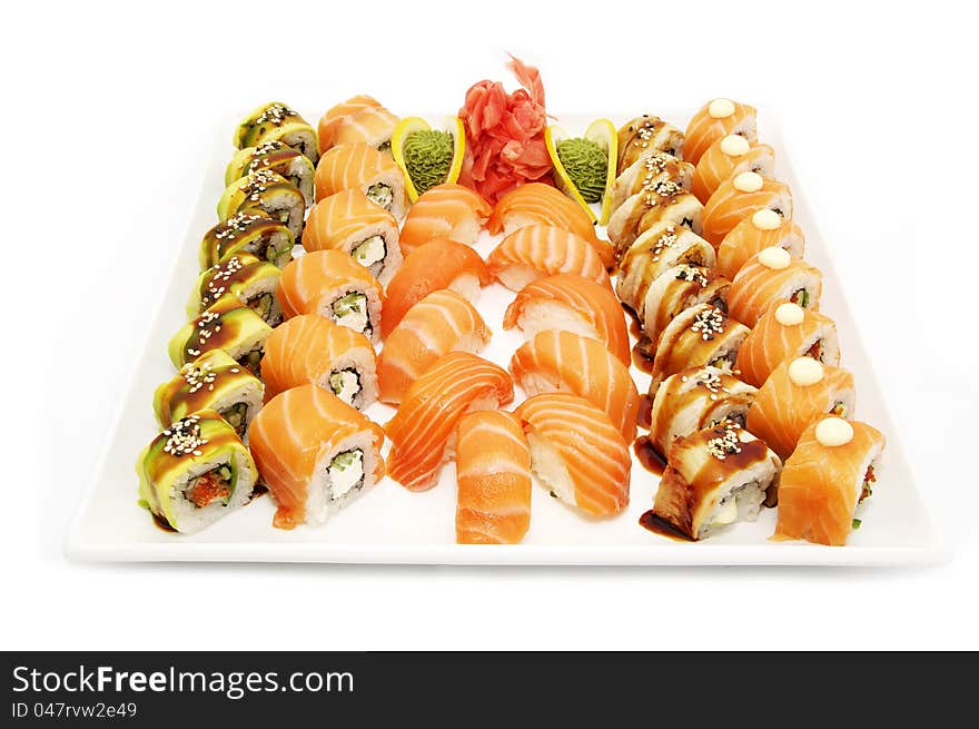 A large plate of Japanese sushi on white background