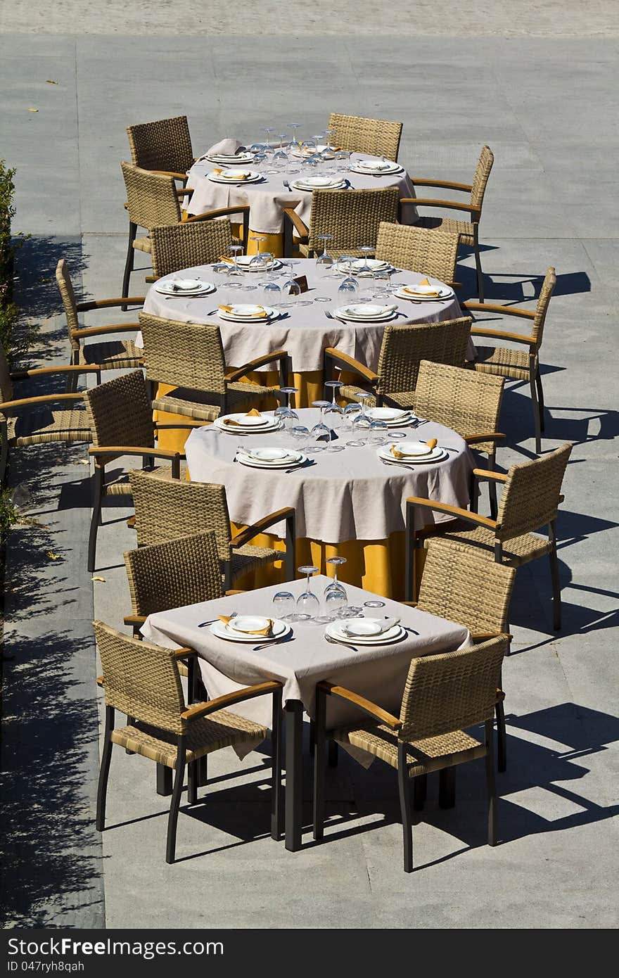 Outdoor restaurant tables at Malaga pier, Spain