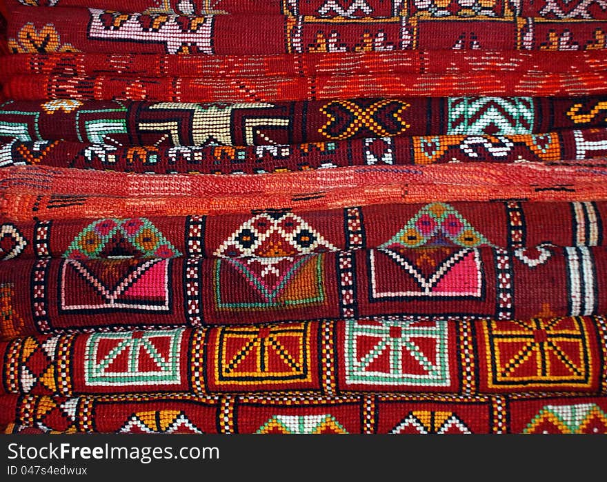 Stack of rugs in carpet sellers shop, Marrakesh Souk. Wonderful colours and geometric patterns!. Stack of rugs in carpet sellers shop, Marrakesh Souk. Wonderful colours and geometric patterns!