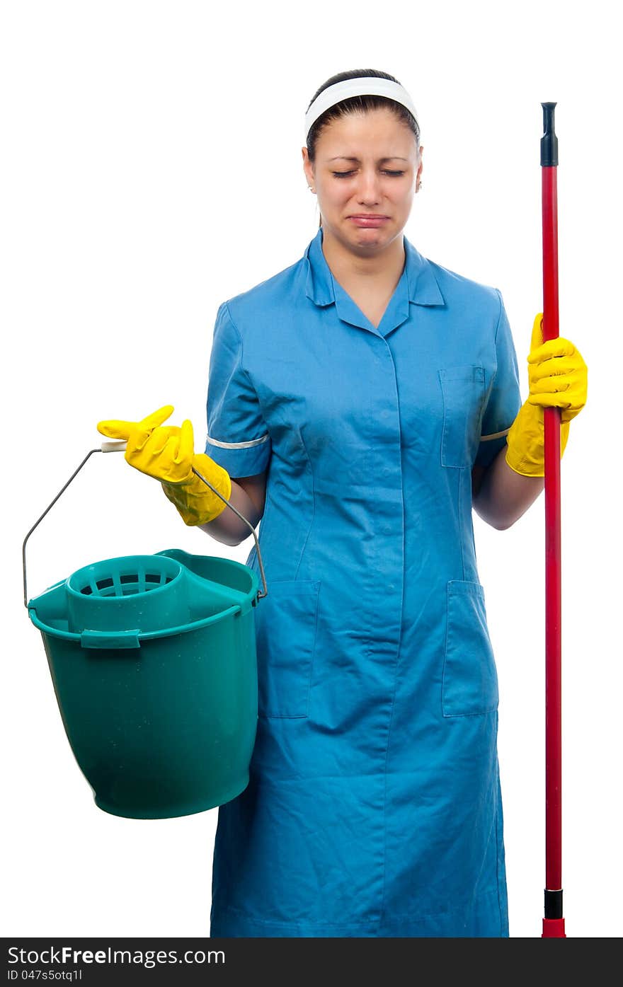 Pretty cleaning lady with bucket and broom crying isolated on white. Pretty cleaning lady with bucket and broom crying isolated on white.