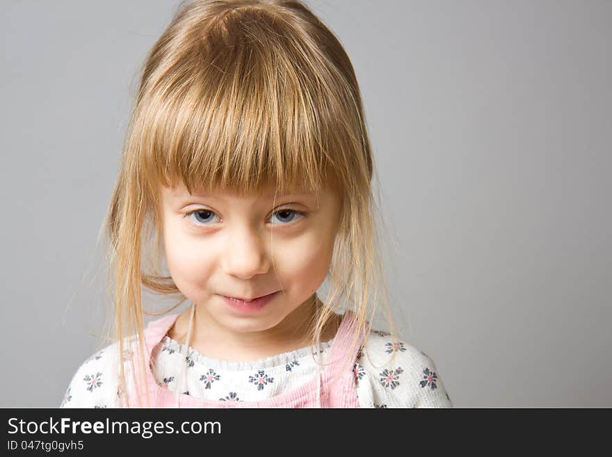 A portrait of a charming little girl. A portrait of a charming little girl.