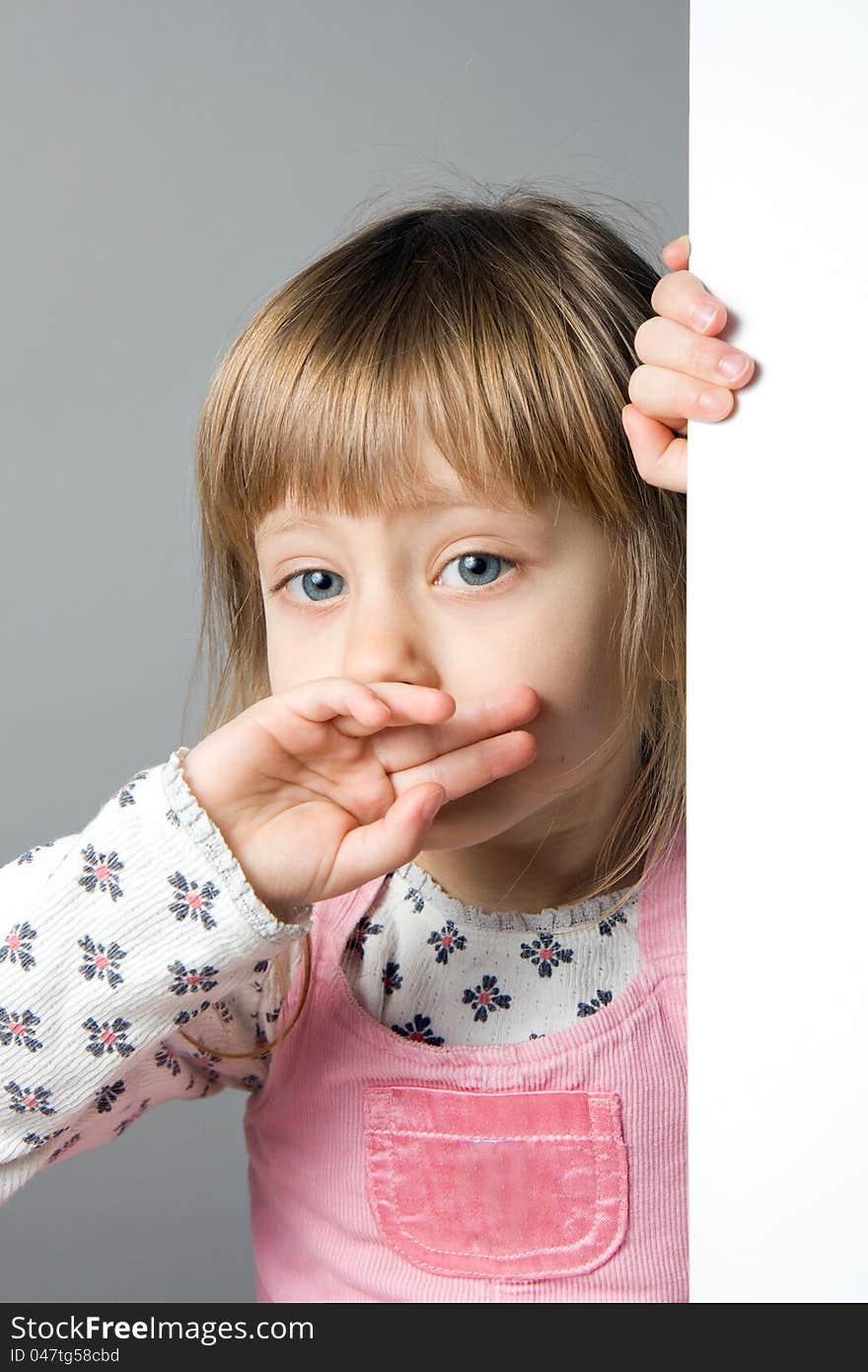 A studio portrait of a girl crying