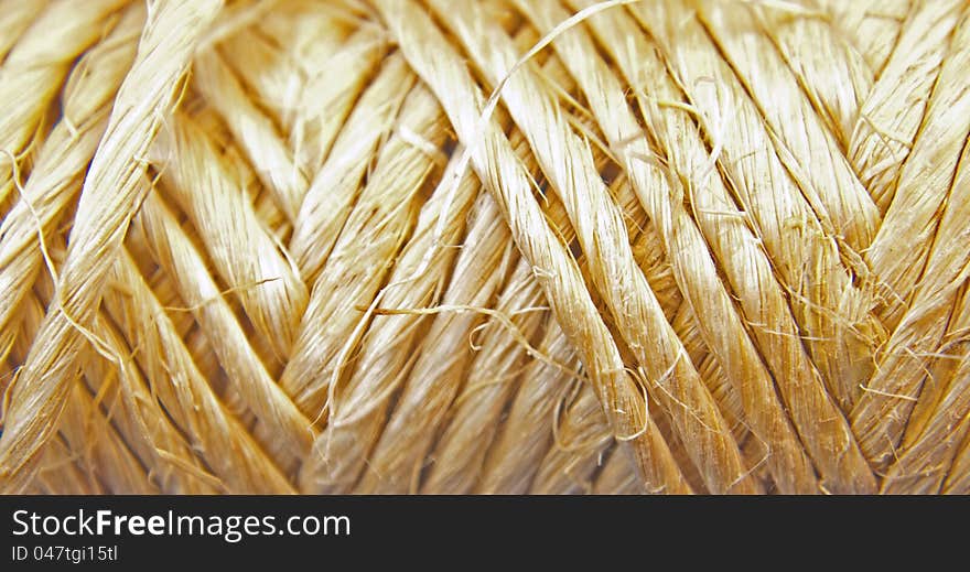 Macro closeup of a roll of twine. Macro closeup of a roll of twine