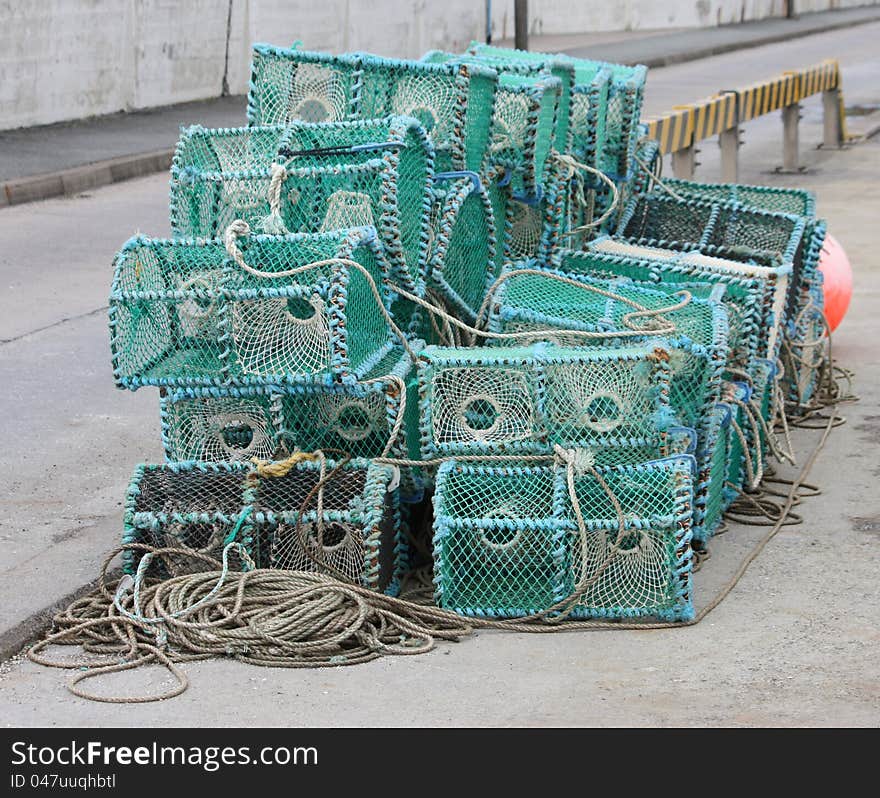 A Pile of Crab Fishing Pots on a Quayside. A Pile of Crab Fishing Pots on a Quayside.